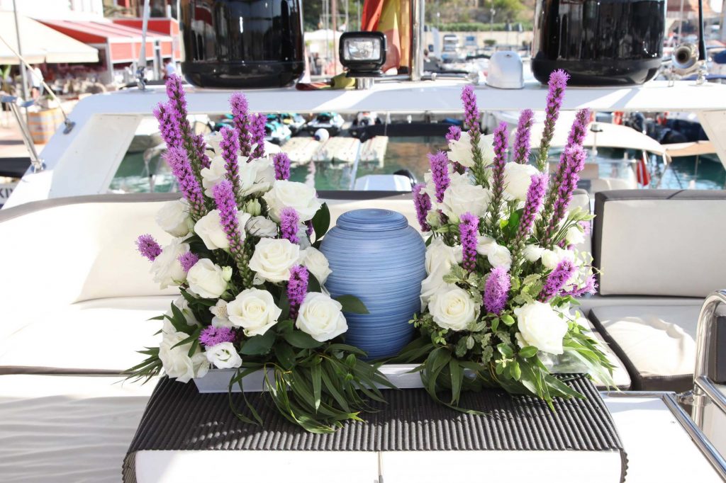 Flower arrangements onboard with biodegradable urn as a centerpiece